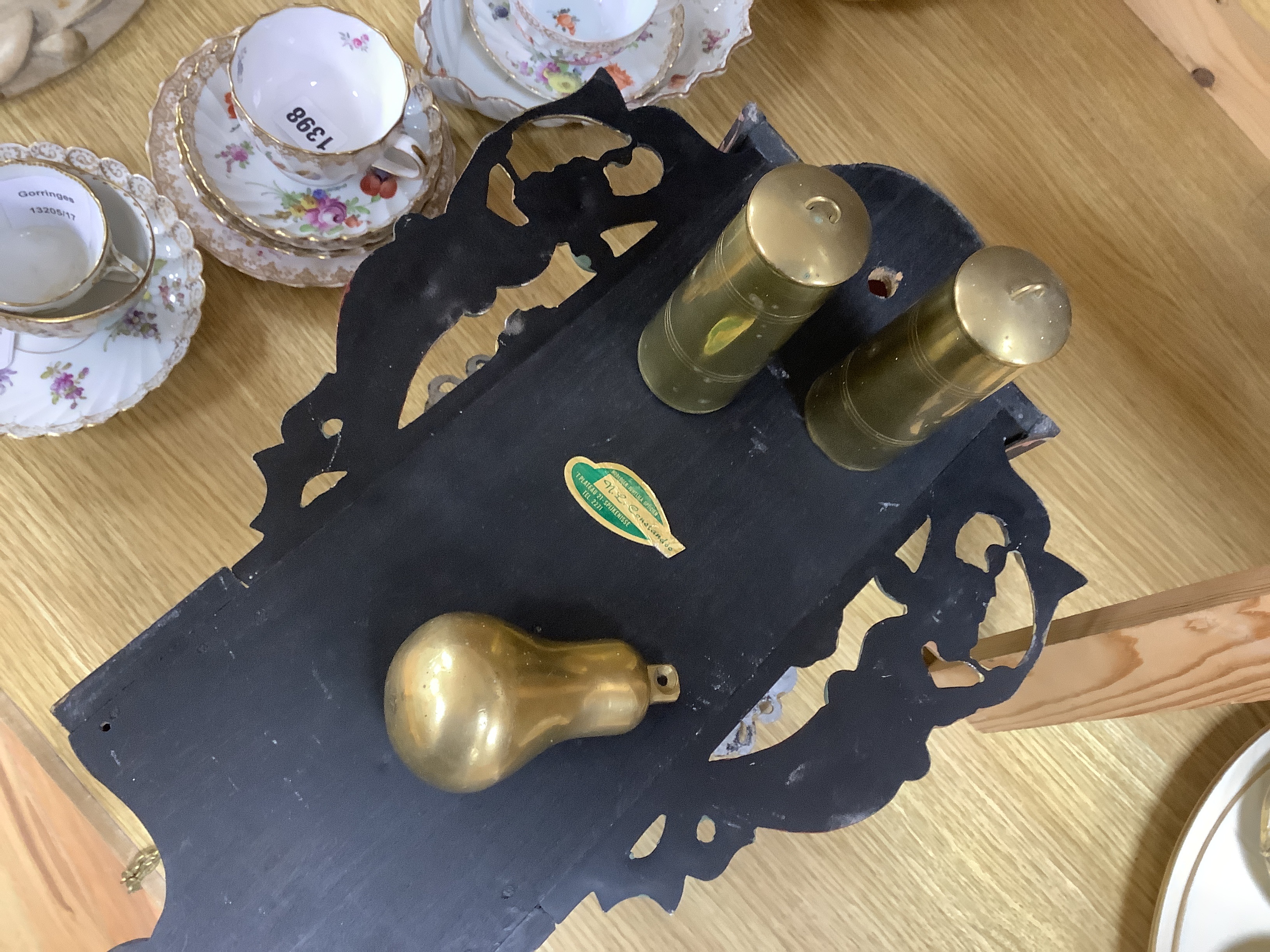 A vintage Dutch clock, hand painted with a landscape and flowers, with pendulum and weights, 53cm high